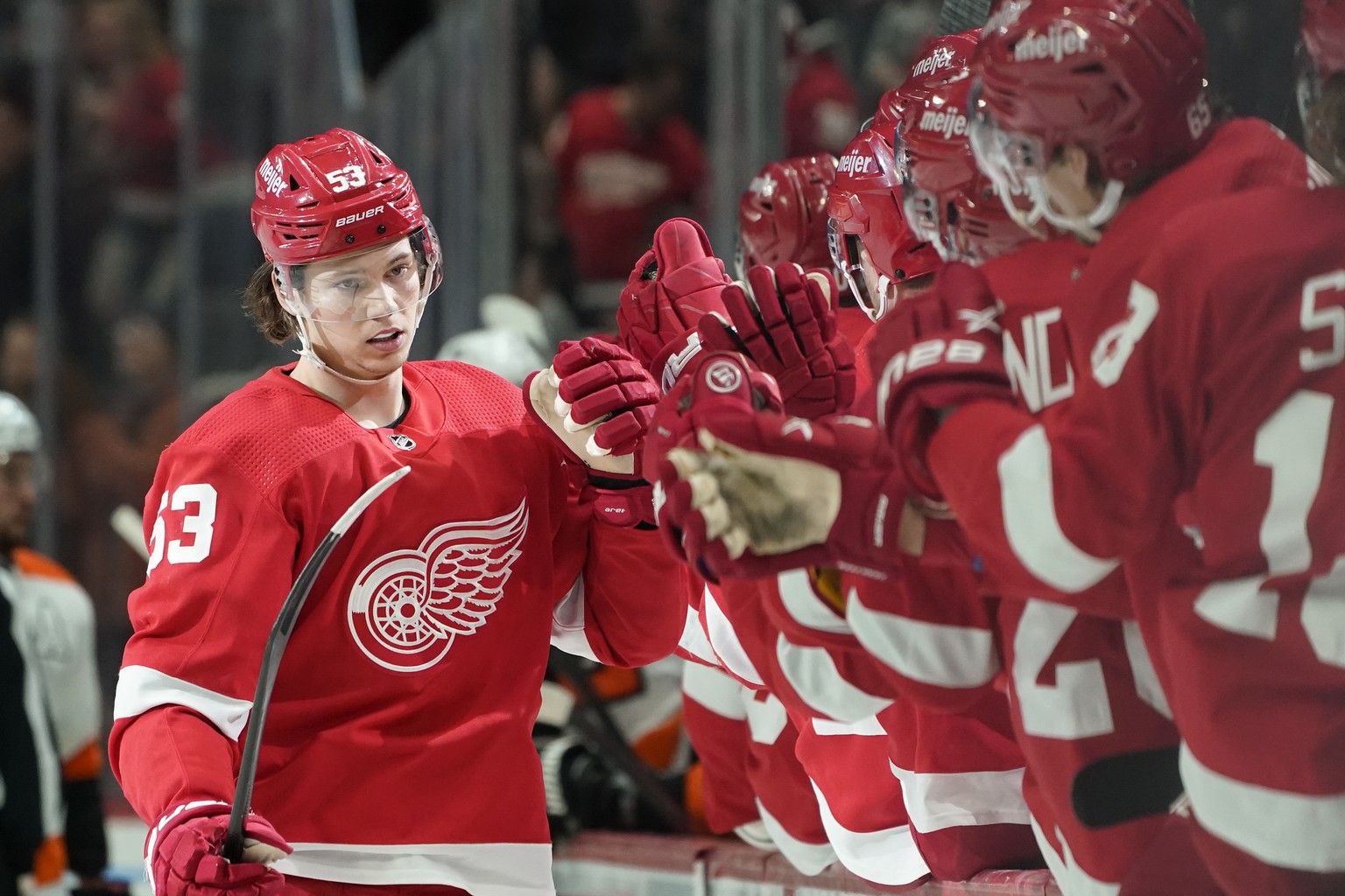 Detroit Red Wings defenseman Moritz Seider (53) celebrates his goal against the Philadelphia Flyers in the third period of an NHL hockey game Saturday, Feb. 12, 2022, in Detroit. (AP Photo/Paul Sancya ...