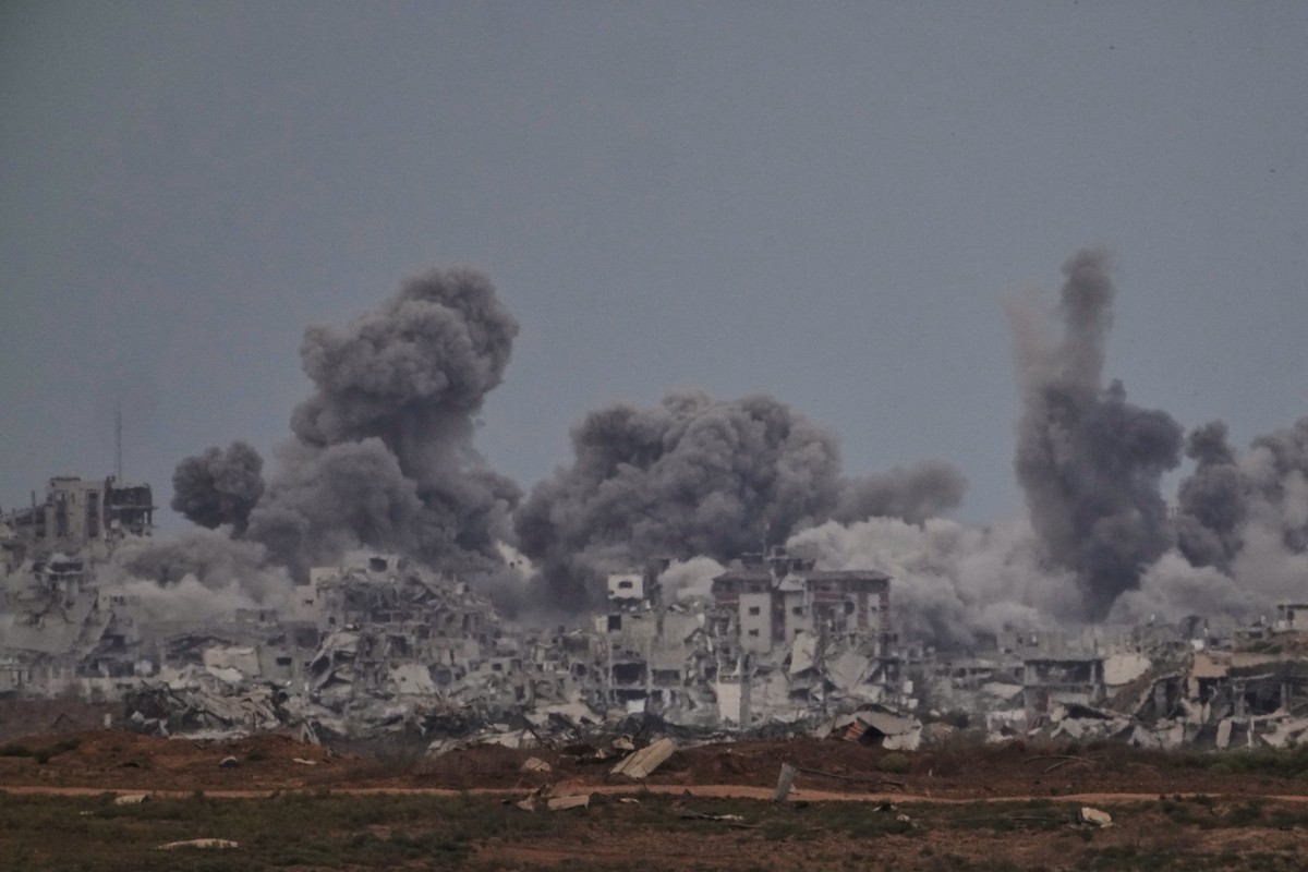 Smoke rises to the sky following an Israeli military strike in the Gaza Strip, as seen from southern Israel, Thursday, Oct. 9, 2025, following the announcement that Israel and Hamas have agreed to the ...