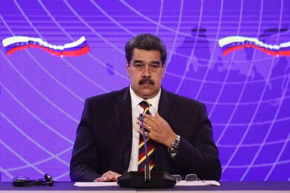 epa09764249 The president of Venezuela, Nicolas Maduro, participates in a joint statement to the media with the deputy prime minister of Russia, Yuri Borisov (out of frame), after the called &#039;mee ...