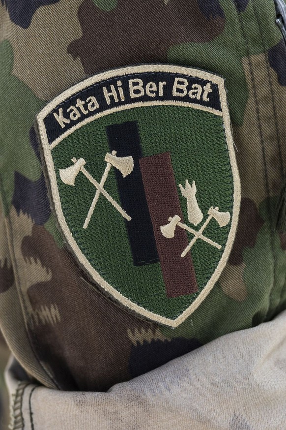 Soldiers of the Military Disaster Relief, the Katastrophenhilfe Bereitschaftsbatallion (Kata Hi Ber Bat) of the Swiss Army, prepare heavy machinery to aid the site of the catastrophic mud slide that c ...