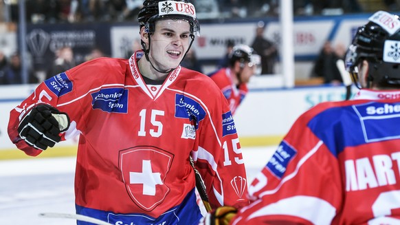 Suisse player Gregory Hofmann celebrates with the team after scoring during the game between Team Suisse and HC Davos at the 91th Spengler Cup ice hockey tournament in Davos, Switzerland, Saturday, De ...