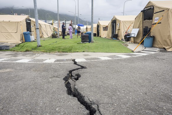 epaselect epa13110697 A damaged street near the United Kingdom's field hospital in Caraballeda, Venezuela, 13 July 2026 (issued 14 July 2026). Fourteen international field hospitals have been est ...