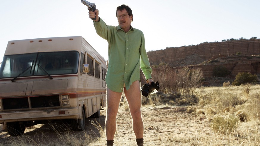 This image released by AMC shows Walter White, played by Bryan Cranston, next to the Winnebago he uses as a mobile meth lab in the pilot episode of &quot;Breaking Bad.&quot; The series finale of the p ...