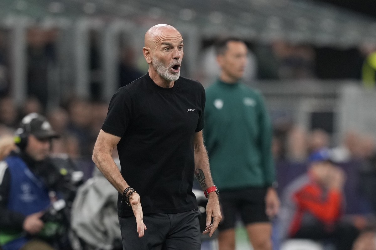 AC Milan's manager Stefano Pioli shouts out as gives instructions from the side line during the Champions League semifinal first leg soccer match between AC Milan and Inter Milan at the San Siro  ...
