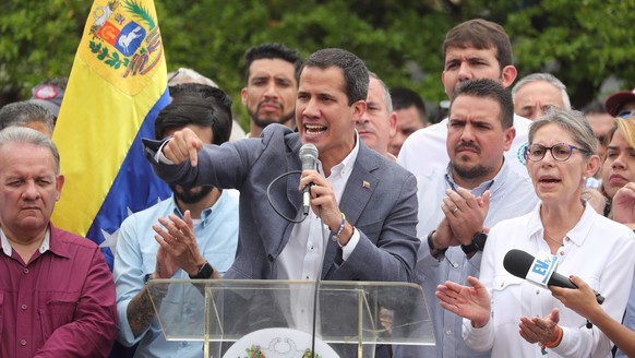 epa07563130 Venezuela's National Assembly President Juan Guaido delivers a speech during a demonstration against the government of Nicolas Maduro at Alfredo Sadel Square in Caracas, Venezuela, 11 May  ...