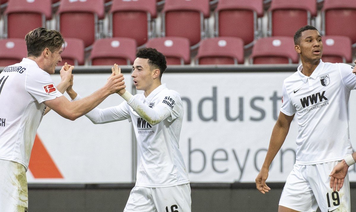 From left: Augsburg's Michael Gregoritsch, Ruben Vargas, Felix Uduokhai and Daniel Caligiuri celebrate after their side's first goal during the German Bundesliga soccer match between FC Augs ...