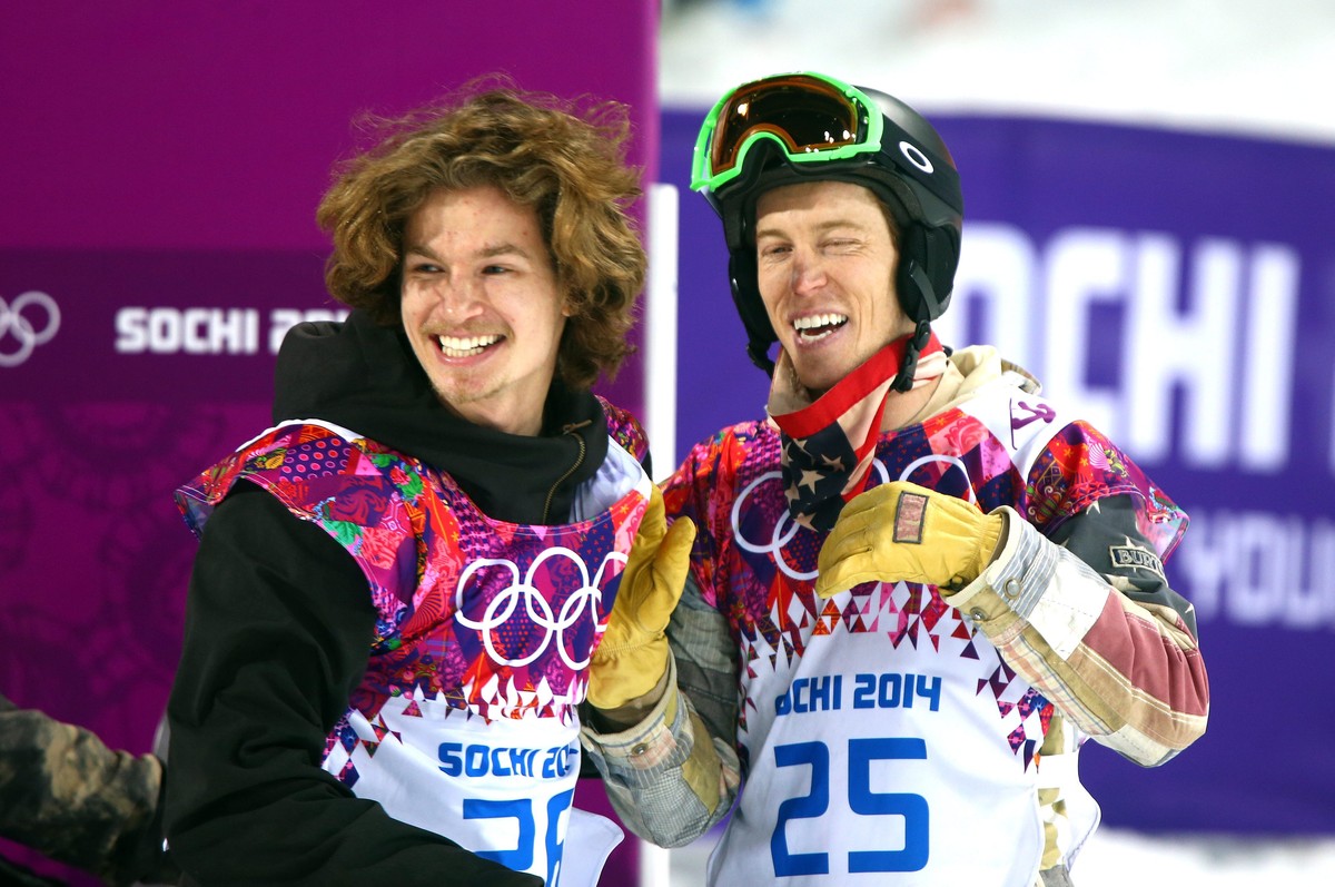epa04070204 Gold medalist Iouri Podladtchikov of Switzerland (L) reacts with Shaun White of USA (R) after the Men's Snowboard Halfpipe Final at Rosa Khutor Extreme Park at the Sochi 2014 Olympic  ...