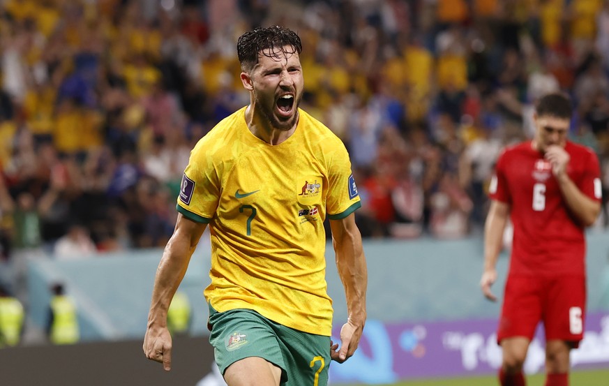 epa10339250 Mathew Leckie of Australia celebrates after scoring the 1-0 during the FIFA World Cup 2022 group D soccer match between Australia and Denmark at Al Janoub Stadium in Al Wakrah, Qatar, 30 N ...
