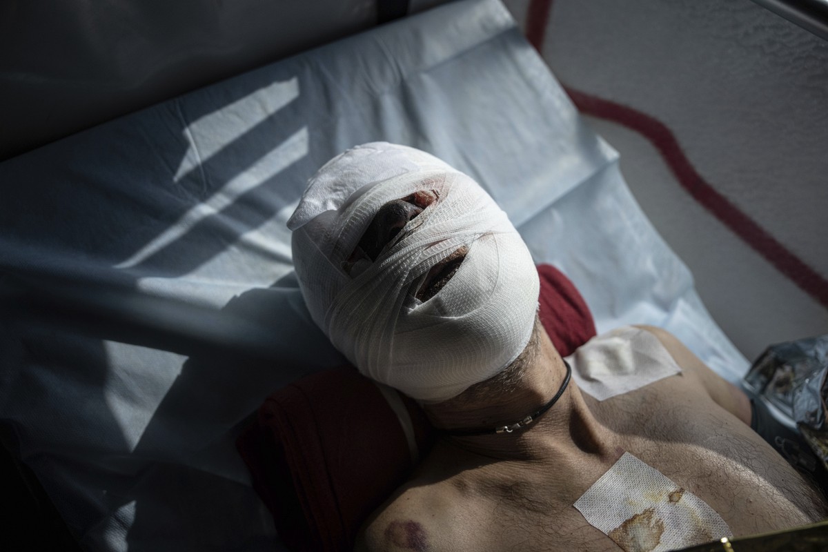 An injured Ukrainian soldier lies on a stretcher during an evacuation in the Donetsk region, Ukraine, Wednesday, March 22, 2023. (AP Photo/Evgeniy Maloletka)