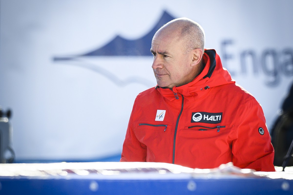 epa09637750 Johan Eliasch, President of the International Ski Federation (FIS), looks on in the finish area, as the race start is lowered due to strong wind conditions, before the women's Super-G ...