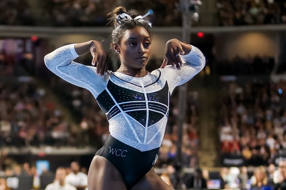 epa10786929 US artistic gymnast Simone Biles competes in the floor exercise during the Core Hydration Classic at the NOW Arena in Hoffman Estates, Illinois, USA, 05 August 2023. Biles is returning to  ...