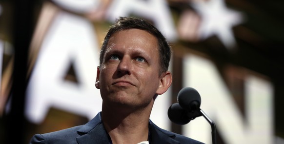 FILE - Billionaire tech investor Peter Thiel looks over the podium before the start of the second day session of the Republican National Convention in Cleveland, Tuesday, July 19, 2016. Thiel, a Silic ...
