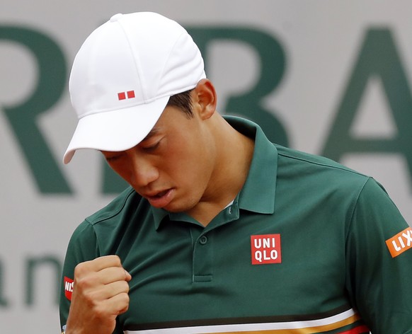 epa06007960 Kei Nishikori of Japan reacts as he plays against Hyeon Chung of South Korea during their men’s singles 3rd round match during the French Open tennis tournament at Roland Garros in Paris,  ...