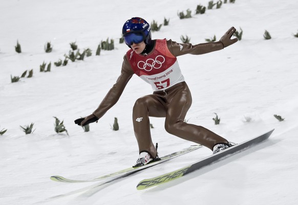 Kamil Stoch, of Poland, lands during qualification for the men&#039;s large hill individual ski jumping competition at the 2018 Winter Olympics in Pyeongchang, South Korea, Friday, Feb. 16, 2018. (AP  ...