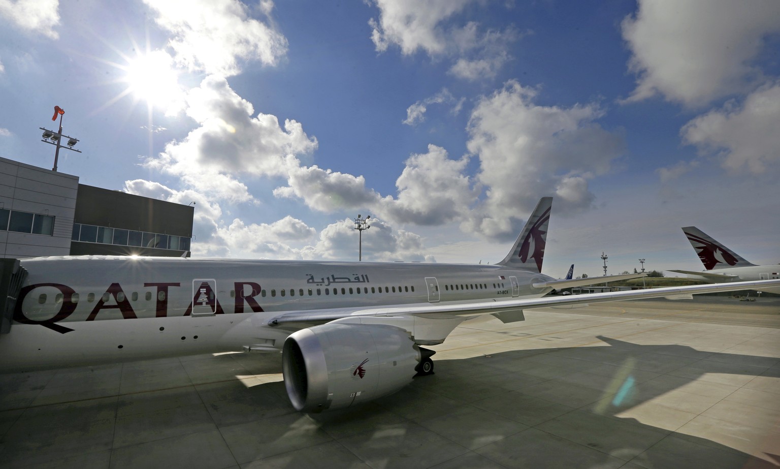 FILE - In this Wednesday, Nov. 4, 2015 file photo, the 24th Boeing 787 airplane purchased by Qatar Airways is photographed, during a delivery ceremony in Everett, Wash. FIFA has signed up Qatar Airway ...