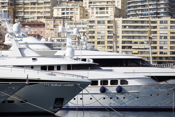 epa09814666 Yachts are moored up at Port Hercules in Monaco, 09 March 2022 (issued 10 March 2022). Monaco was quick to announce that it had joined the EU to sanction the list published of some 500 oli ...