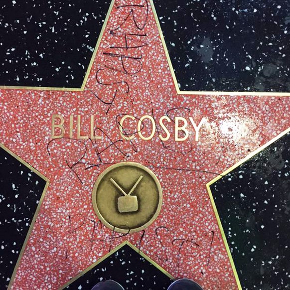 This Dec. 2, 2014 photo by Josh Keown posted on his Twitter page shows the graffiti scrawled on the Hollywood Walk of Fame star of actor-comedian Bill Cosby in the Hollywood district of Los Angeles. T ...