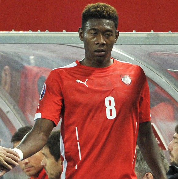 Austria&#039;s head coach Marcel Koller, left, shakes hand with David Alaba during of the Euro 2016 soccer qualifying group G match between Austria and Moldova in Vienna, Austria, Saturday, Sep. 5, 20 ...