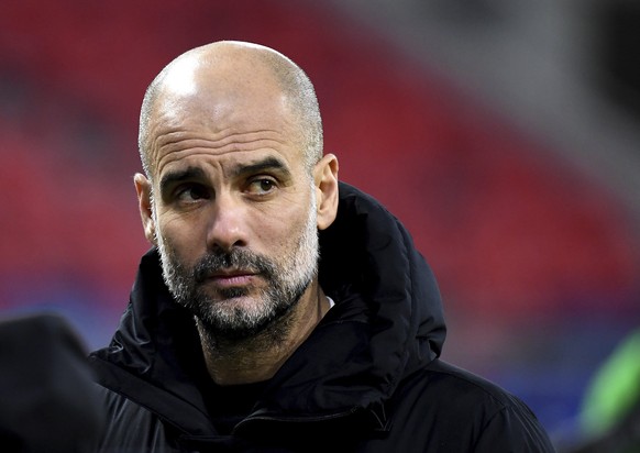 Manchester City's head coach Pep Guardiola reacts after a Champions League round of 16 second leg soccer match between Manchester City and Borussia Moenchengladbach at the Puskas Arena in Budapes ...