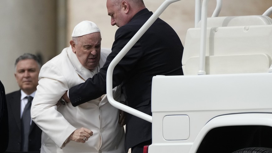 Pope Francis is helped into his car at the end of the weekly general audience in St. Peter&#039;s Square, at the Vatican, Wednesday, March 29, 2023. Pope Francis went to a Rome hospital on Wednesday f ...