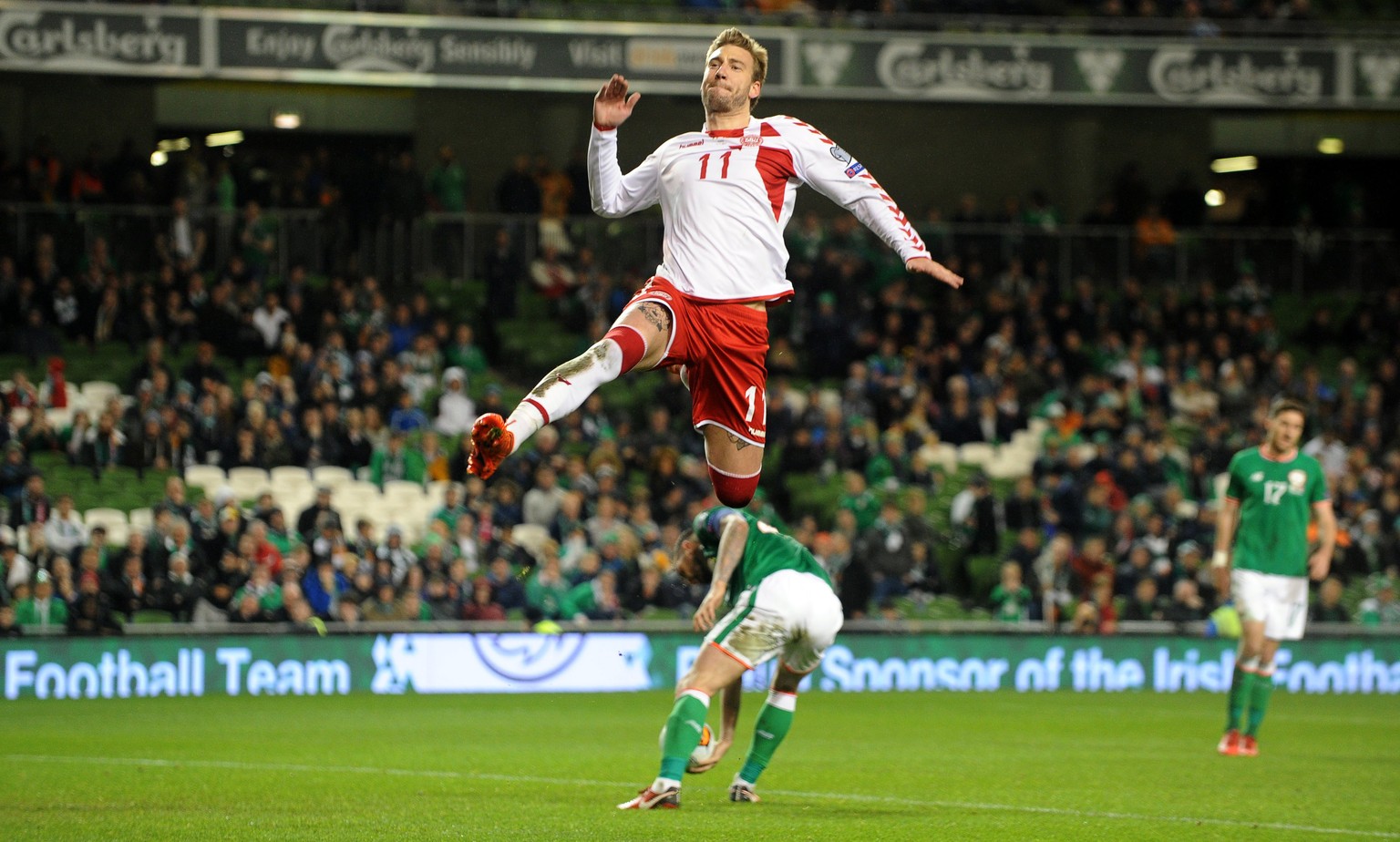 epa06329768 Denmark&#039;s Nicklas Bendtner celebrates after scoring the 5-1 lead from the penalty spot during the FIFA World Cup 2018 qualification playoff, second leg soccer match between Ireland an ...