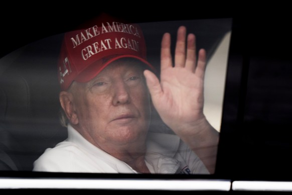 President Donald Trump waves to supporters from his limousine as he arrives at Trump International Golf Club, Saturday, March 29, 2025, in West Palm Beach, Fla. (AP Photo/Manuel Balce Ceneta)
Donald T ...