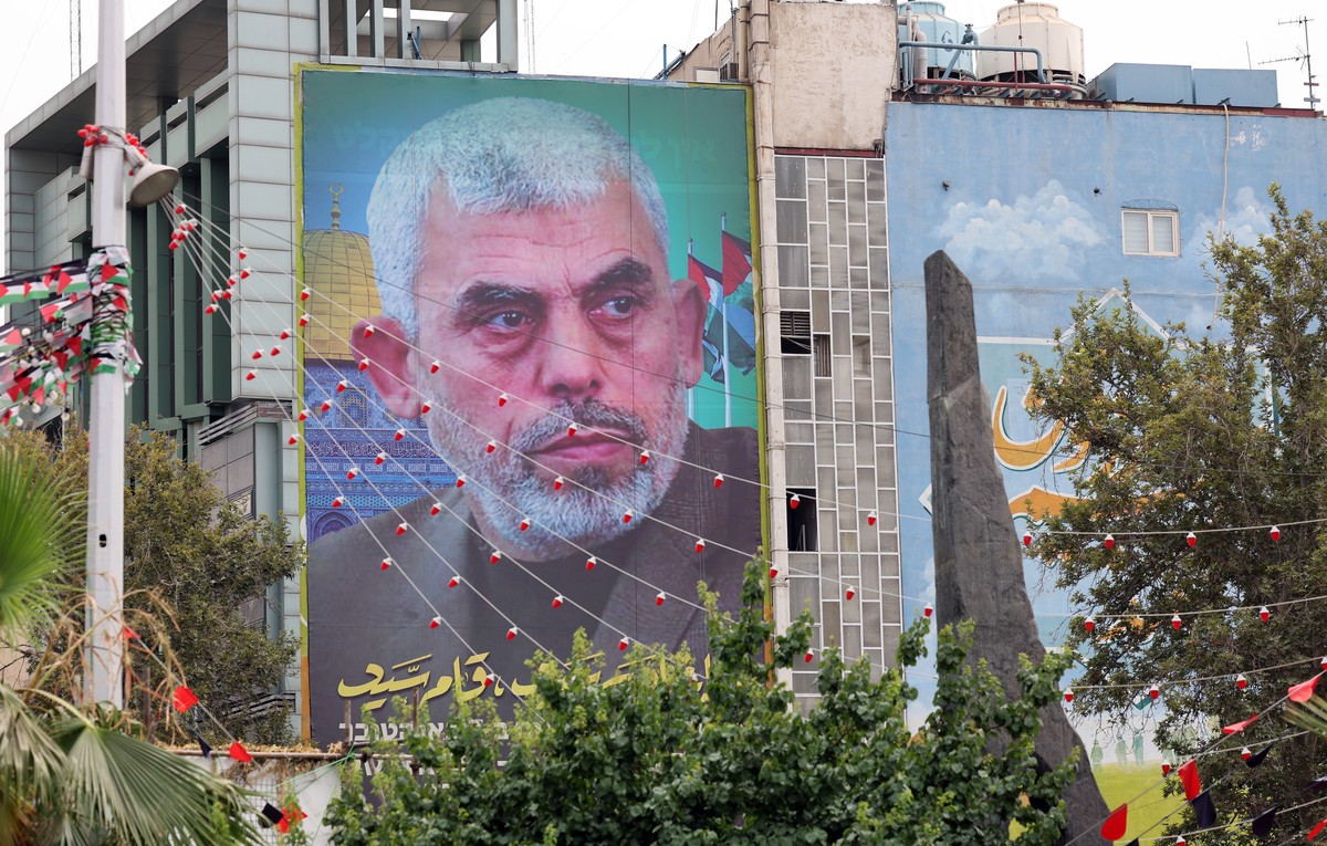 epa11546484 A billboard of new Hamas leader Yahya Al-Sinwar hanging on a wall at the Palestine Square in Tehran, Iran, 12 August 2024. Tension remains high between Iran and Israel since late Hamas lea ...