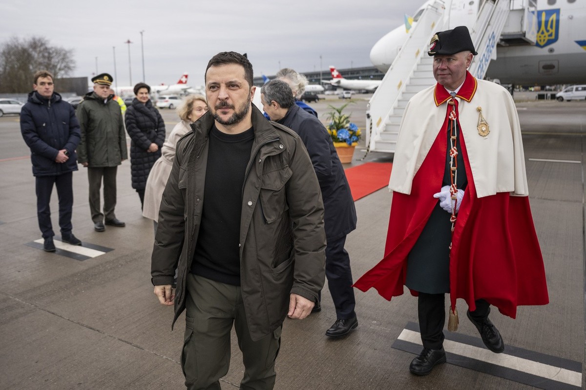 Volodymyr Zelenskyy, President of Ukraine, center, looks on after his arrival, followed by Switzerland's Foreign Minister Federal Councillor Ignazio Cassis, 2nd right, on Monday, January 15, 2024 ...