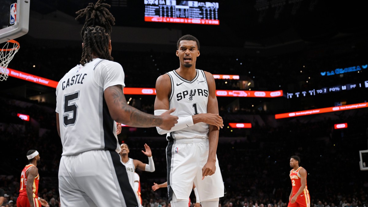 San Antonio Spurs players Victor Wembanyama (1) and Stephon Castle (5) speak after a play during a preseason NBA basketball game against the Atlanta Hawks, Thursday, Oct. 8, 2026, in San Antonio. (AP  ...