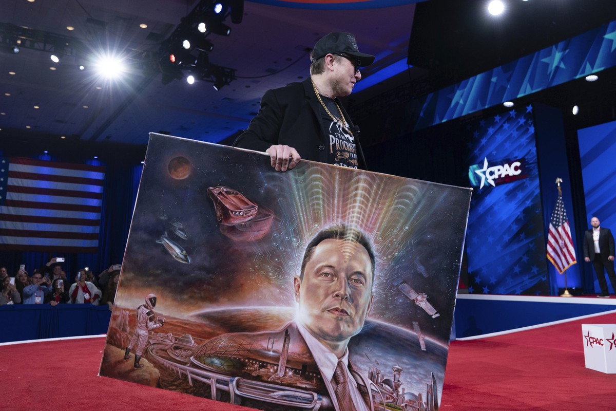 FILE - Elon Musk holds a painting after speaking at the Conservative Political Action Conference, CPAC, at the Gaylord National Resort &amp; Convention Center, Feb. 20, 2025, in Oxon Hill, Md. (AP Pho ...
