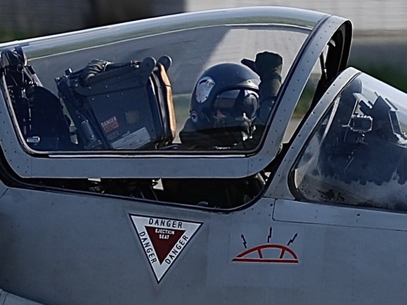 epa10108337 A Mirage 2000-5 fighter jet pilot strikes a thumbs up hand signal while taxing upon landing at an airbase in Hsinchu, Taiwan, 06 August 2022. After the visit of US House of Representatives ...
