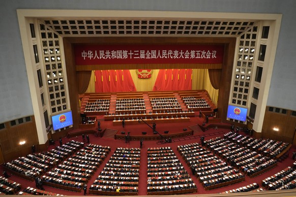 Delegates attend the closing session of China&#039;s National People&#039;s Congress (NPC) at the Great Hall of the People in Beijing, Friday, March 11, 2022. (AP Photo/Sam McNeil)