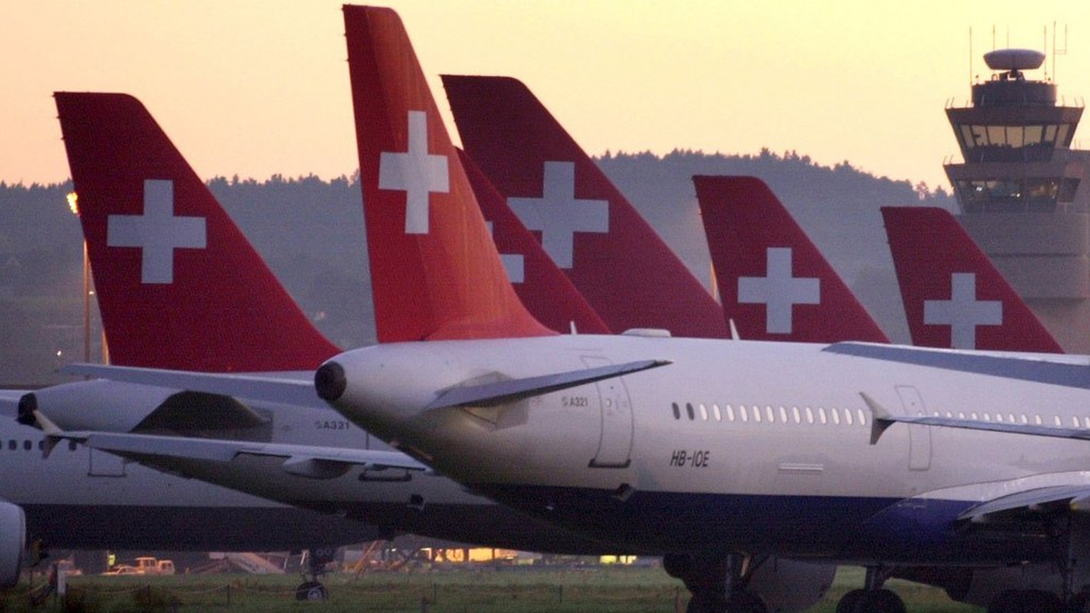 Swissair planes remain on the ground at the airport in Zurich-Kloten, Switzerland, in the early morning hours, October 3, 2001. Swissair&#039;s entire fleet remains grounded as the collapsed Swiss fla ...
