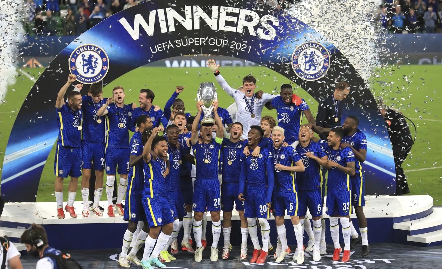 Chelsea players celebrate with the trophy after winning the UEFA Super Cup soccer match against Villarreal at Windsor Park in Belfast, Northern Ireland, Wednesday, Aug. 11, 2021. (AP Photo/Peter Morri ...