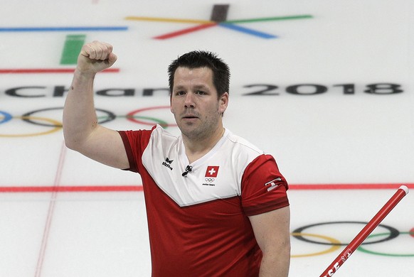 Switzerland Martin Rios reacts after winning their mixed doubles curling match against Olympic Athletes from Russia at the 2018 Winter Olympics in Gangneung, South Korea, Sunday, Feb. 11, 2018. (AP Ph ...