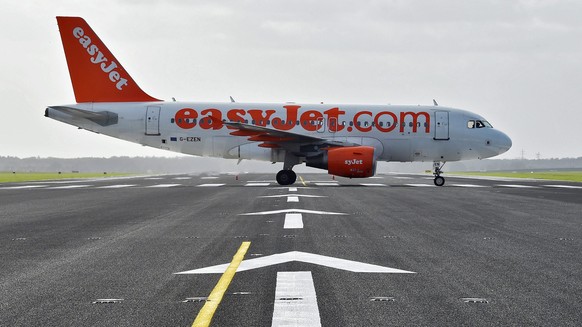 epa05401383 (FILE) A file photo dated 23 October 2015 showing an Airbus A319 of Easyjet crossing the redeveloped northern runway as it taxies to the start on the southern runway of the airfield at Sch ...