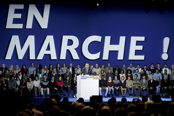 FILE PHOTO Emmanuel Macron, head of the political movement En Marche !, or Forward !, and candidate for the 2017 French presidential election, attends a political rally in Paris, France December 10, 2 ...