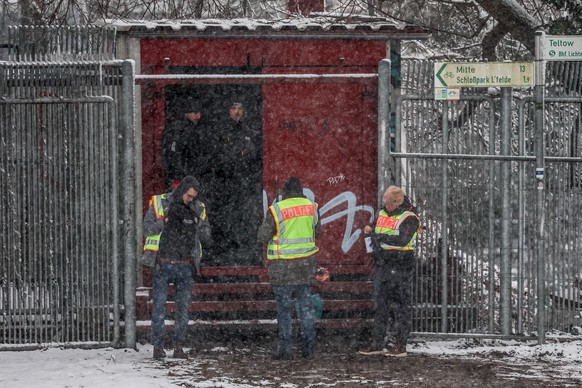 epa12622595 Police officers inspect a power distribution system near the 'Lichterfelde' combined heat and power plant, responsible for the supply of electricity and urban heat to southwester ...