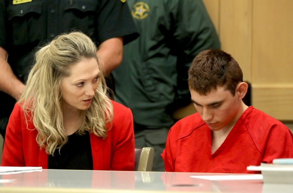 epa06543859 Nikolas Cruz (R) appears in court for a status hearing before Broward Circuit Judge Elizabeth Scherer in Fort Lauderdale, Florida, USA, 19 February 2018. Cruz is facing 17 charges of preme ...