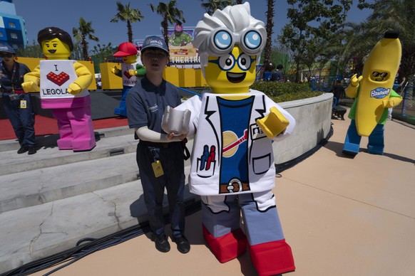 Workers guide Lego mascot characters during the opening of Legoland Shanghai, China&#039;s first Legoland resort, in Shanghai, Saturday, July 5, 2025. (AP Photo/Ng Han Guan)
China Legoland