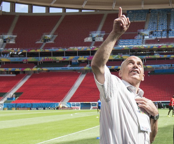 Swiss Federal Minister Ueli Maurer, left, and Peter Gillieron, President of the Swiss football association, talk during a training session of the Swiss national soccer team in the National Stadium in  ...