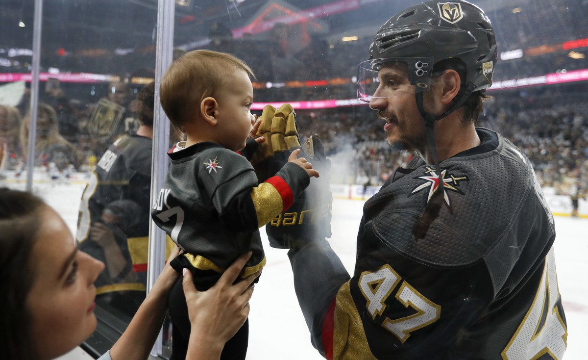 Vegas Golden Knights defenseman Luca Sbisa greets a young fan before Game 4 of the team's NHL hockey Western Conference finals against the Winnipeg Jets, Friday, May 18, 2018, in Las Vegas. (AP P ...