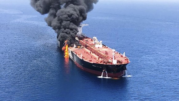 An oil tanker is on fire in the sea of Oman, Thursday, June 13, 2019. Two oil tankers near the strategic Strait of Hormuz were reportedly attacked on Thursday, an assault that left one ablaze and adri ...