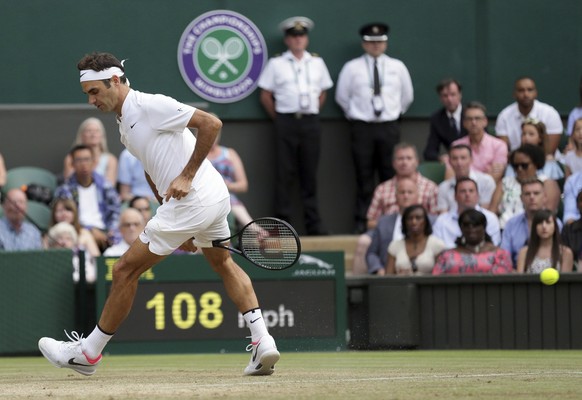 Switzerland&#039;s Roger Federer returns to Germany&#039;s Mischa Zverev during their Men&#039;s Singles Match on day six at the Wimbledon Tennis Championships in London Saturday, July 8, 2017. (AP Ph ...