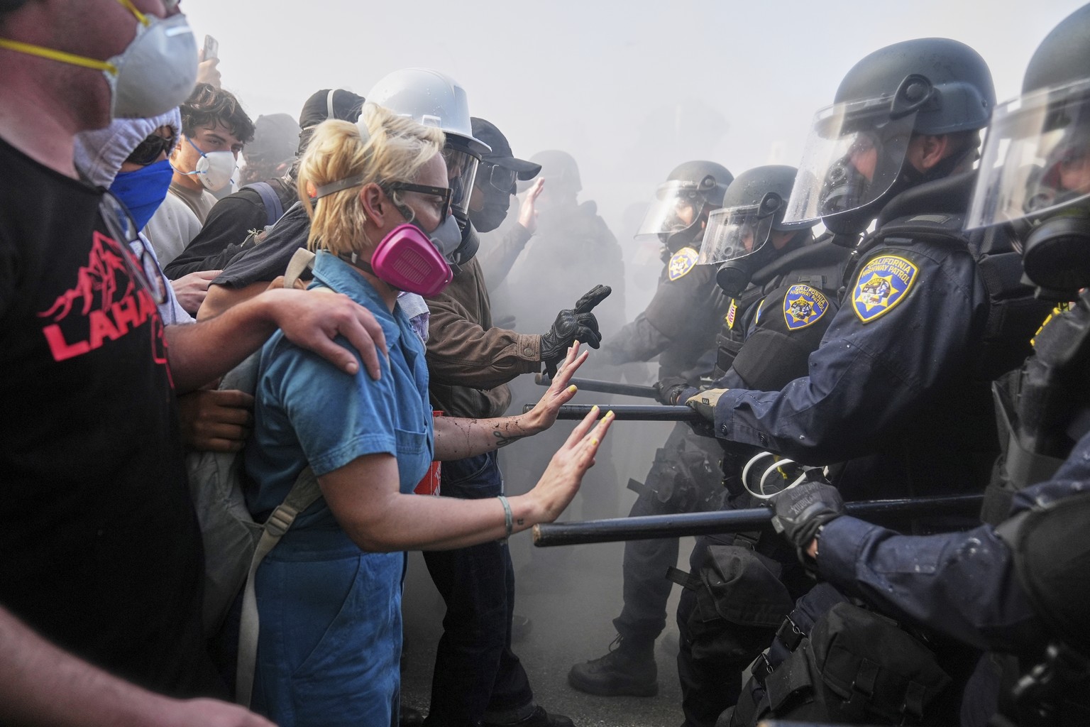 FILE - Protesters confront police on the 101 Freeway near the Metropolitan Detention Center in downtown Los Angeles, Sunday, June 8, 2025, following last night&#039;s immigration raid protest. (AP Pho ...