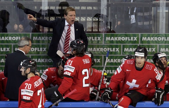 Switzerland&#039;s coach Glen Hanlon (top) gestures to players during their Ice Hockey World Championship game against Austria at the O2 arena in Prague, Czech Republic May 2, 2015. REUTERS/David W Ce ...