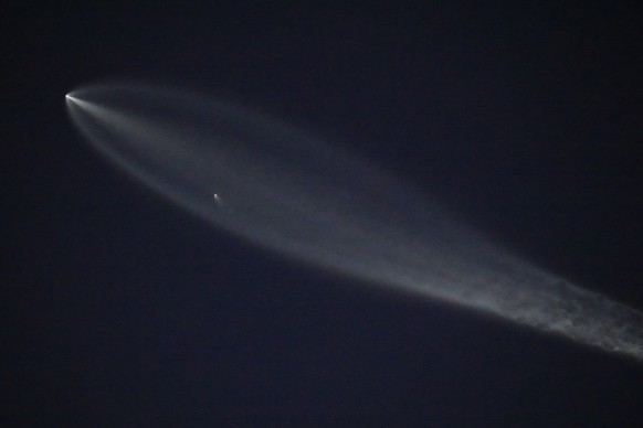 A SpaceX Falcon 9 rocket carrying 26 Starlink satellites launched from Vandenberg Space Force Base in Calif., flies over Los Angeles Monday, June 16, 2025. (AP Photo/Damian Dovarganes)
SpaceX Falcon 9 ...