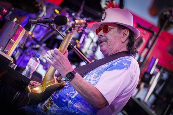 Latin-rock guitarist Carlos Santana from the U.S. performs on the Lake stage during the 59th Montreux Jazz Festival (MJF), in Montreux, Switzerland, Friday, July 18, 2025. (KEYSTONE/Valentin Flauraud)