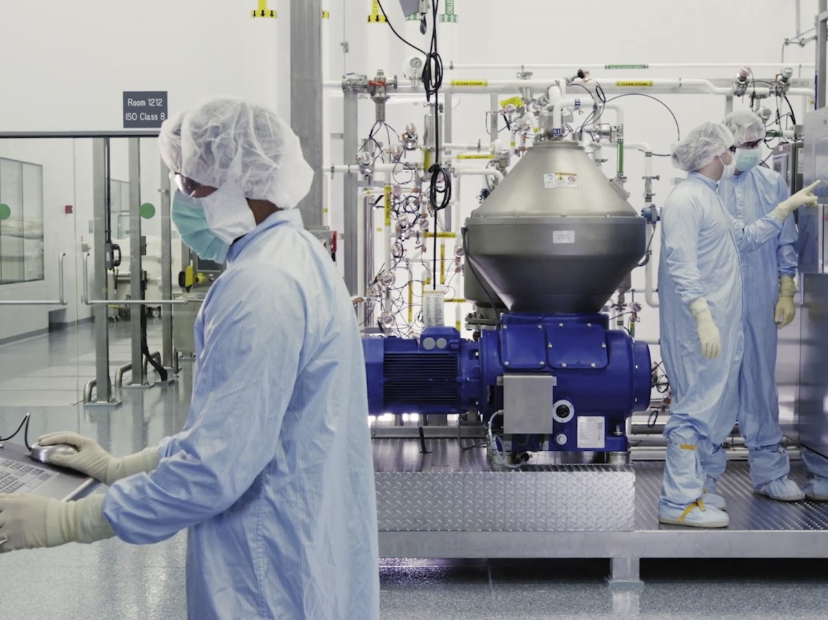In this undated image from video provided by Regeneron Pharmaceuticals on Friday, Oct. 2, 2020, scientists work with a bioreactor at a company facility in New York state, for efforts on an experimenta ...