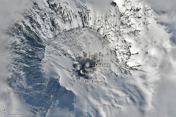 November 25, 2023 - Antarctica - The summit crater of Mount Erebus, the world s southernmost active volcano, appeared above the clouds on a late-spring day in 2023. The OLI-2 on Landsat 9 captured thi ...